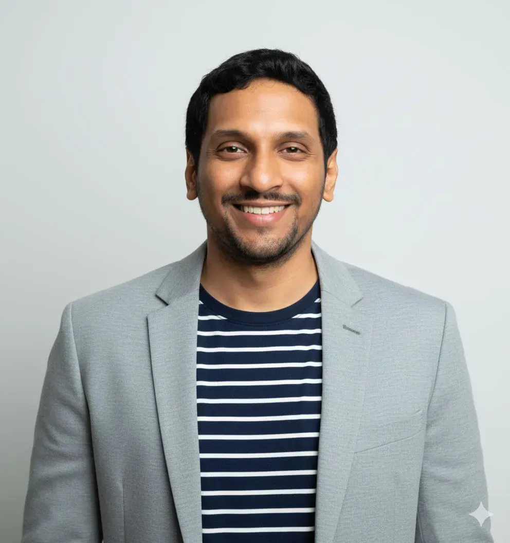 A person wearing a light gray blazer over a navy blue and white horizontal striped shirt. Image generated using Nano Banana.