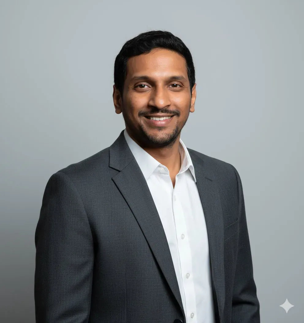 A person wearing a dark gray/charcoal blazer over a white dress shirt with an open collar. Image generated using Nano Banana.
